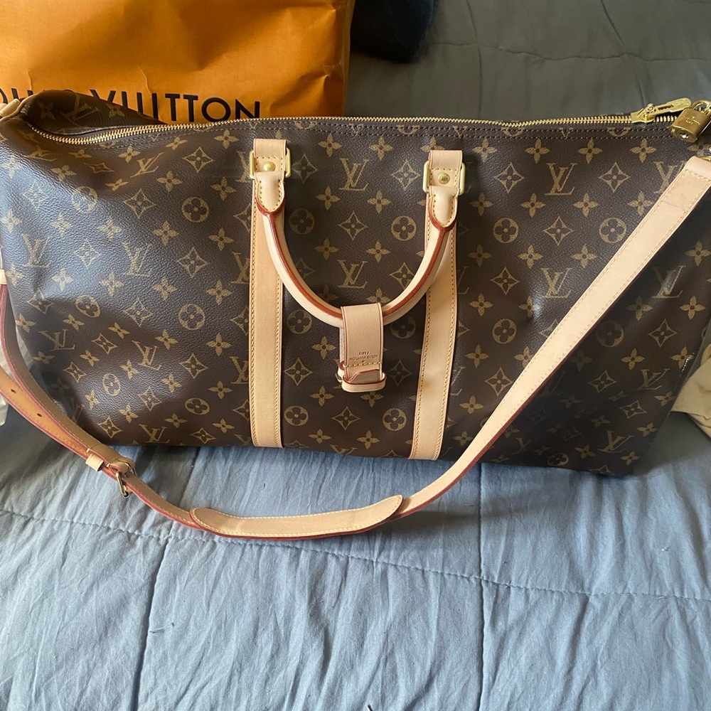 Louis Vuitton Keepall 55. New, never used, with duster.
